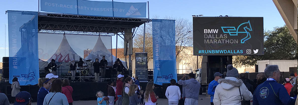 LED screen rentals at the dallas marathon displaying digital signage on the side of a stage