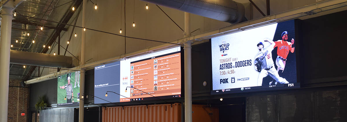 led screen rentals at a bar in portland displaying food ordering app and live tv football