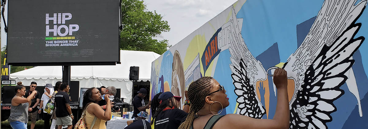 led screen rental in long beach displaying hip hop messaging and mural painters